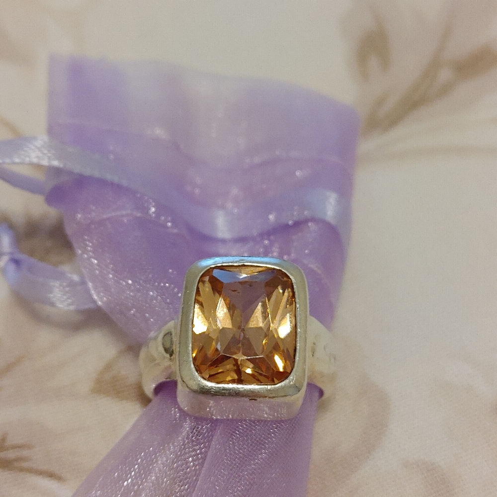 Silver and topaz ring